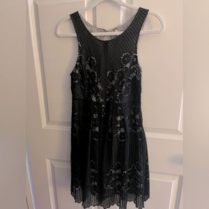 Free people, black lace tank dress with open back.